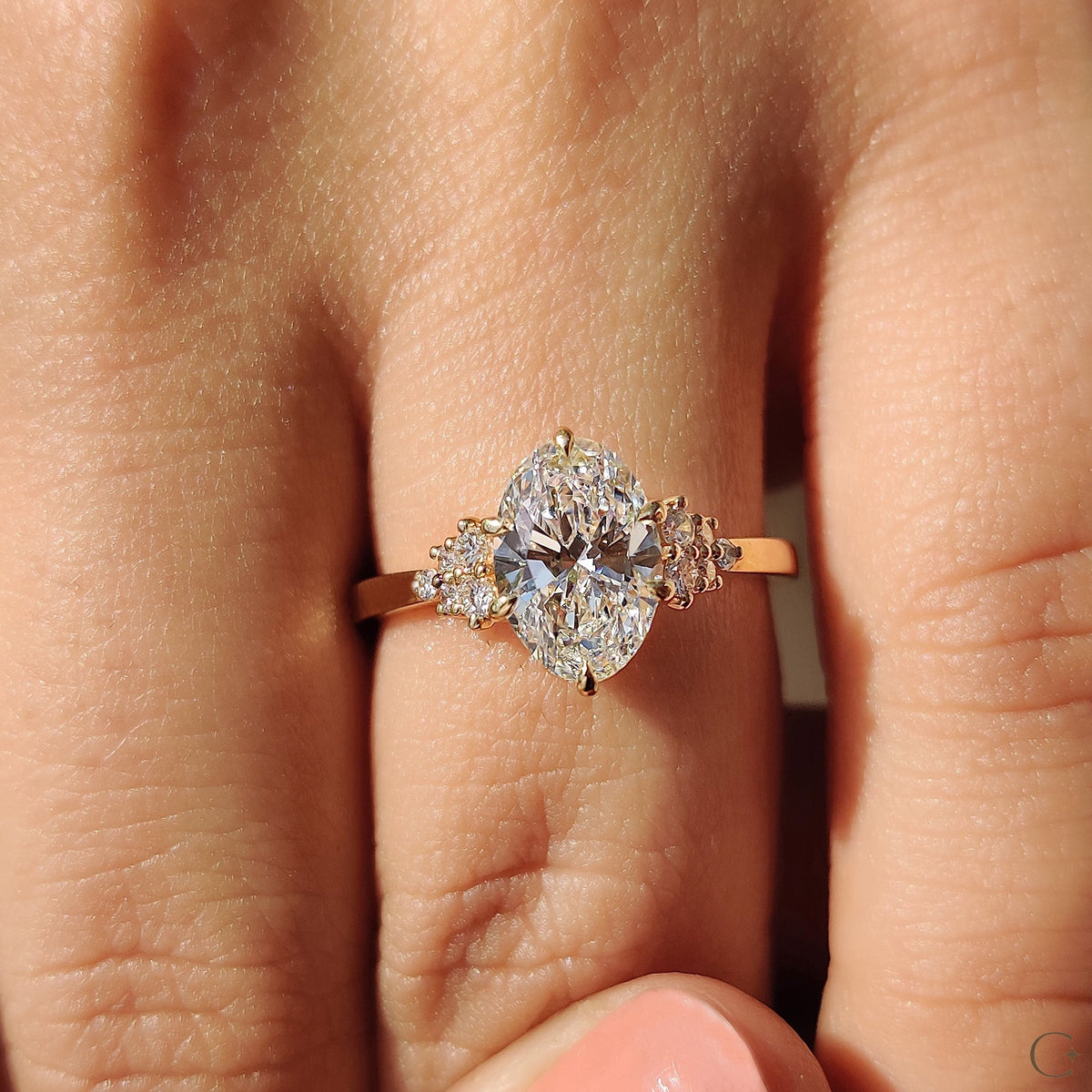 Oval Diamond Ring With Round Cut Side Stone