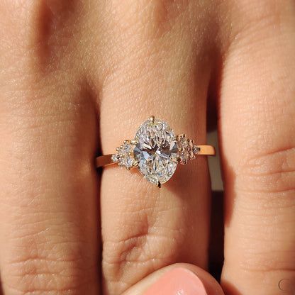 Oval Diamond Ring With Round Cut Side Stone