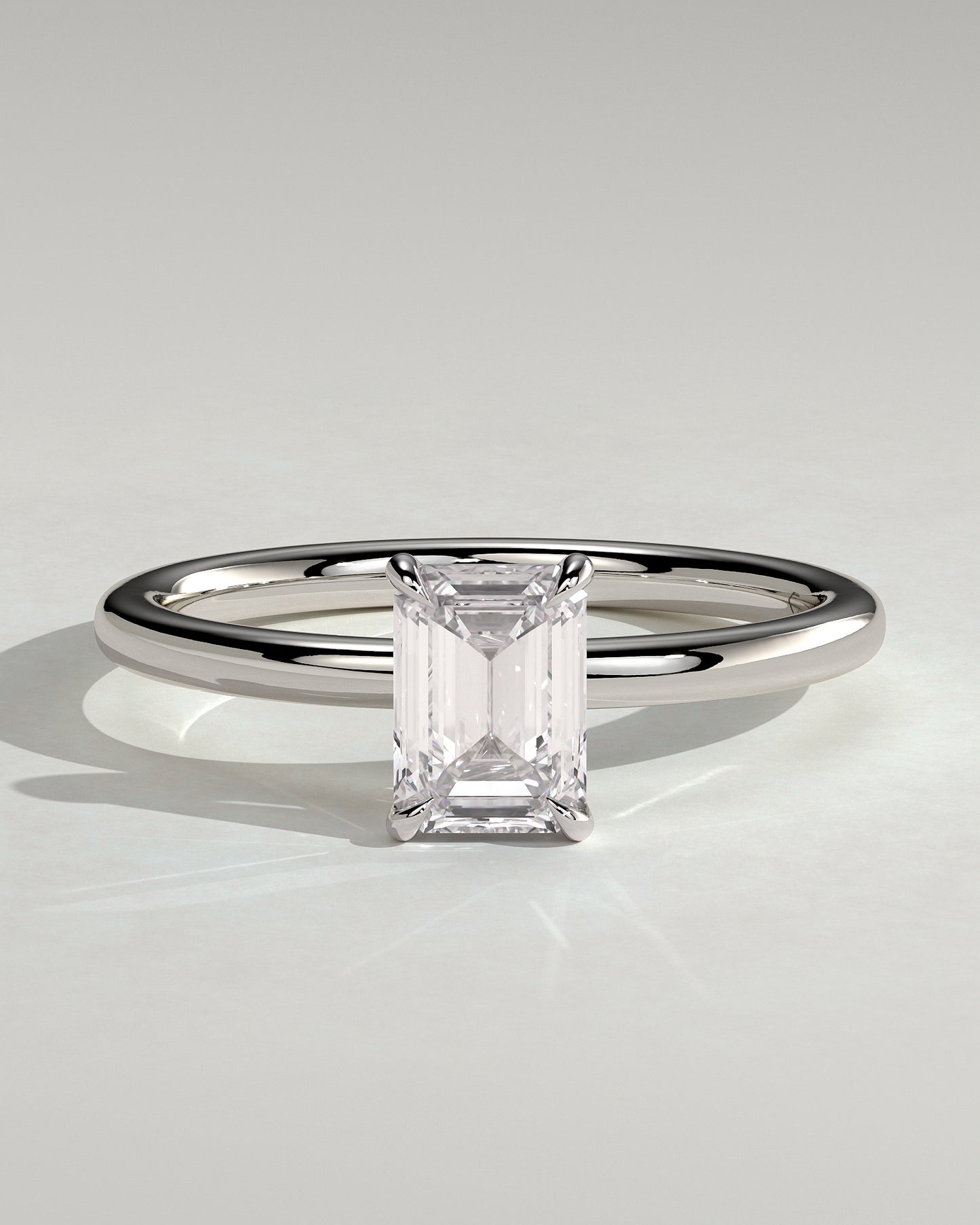 Alina - Emerald Claw Solitaire Engagement Ring - Platinum