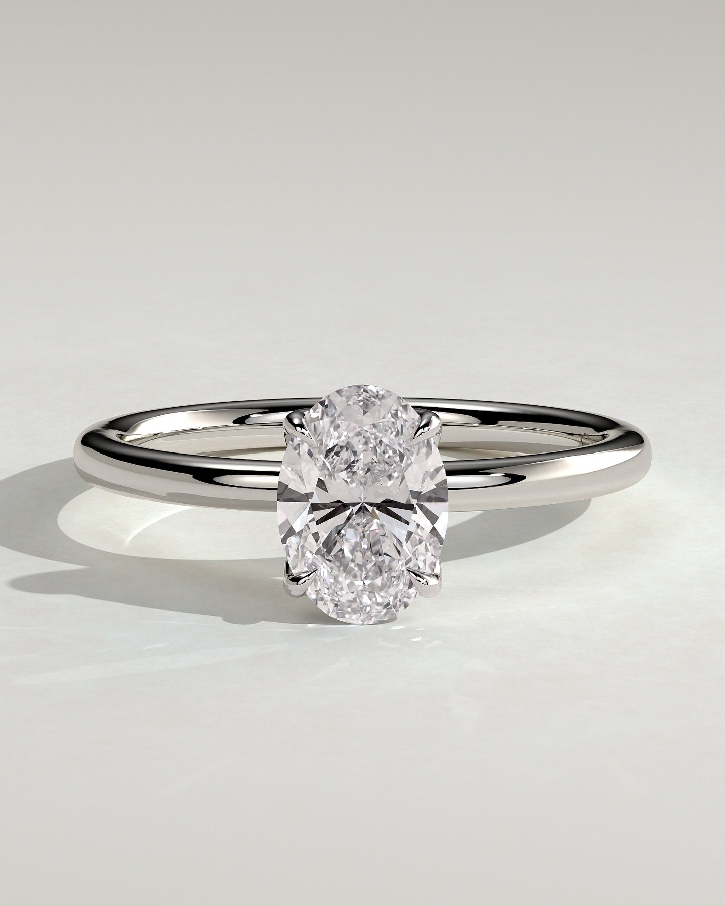 Aurelie - Oval Claw Solitaire with Petal Gallery and Accent Leaf Detail Engagement Ring - Platinum