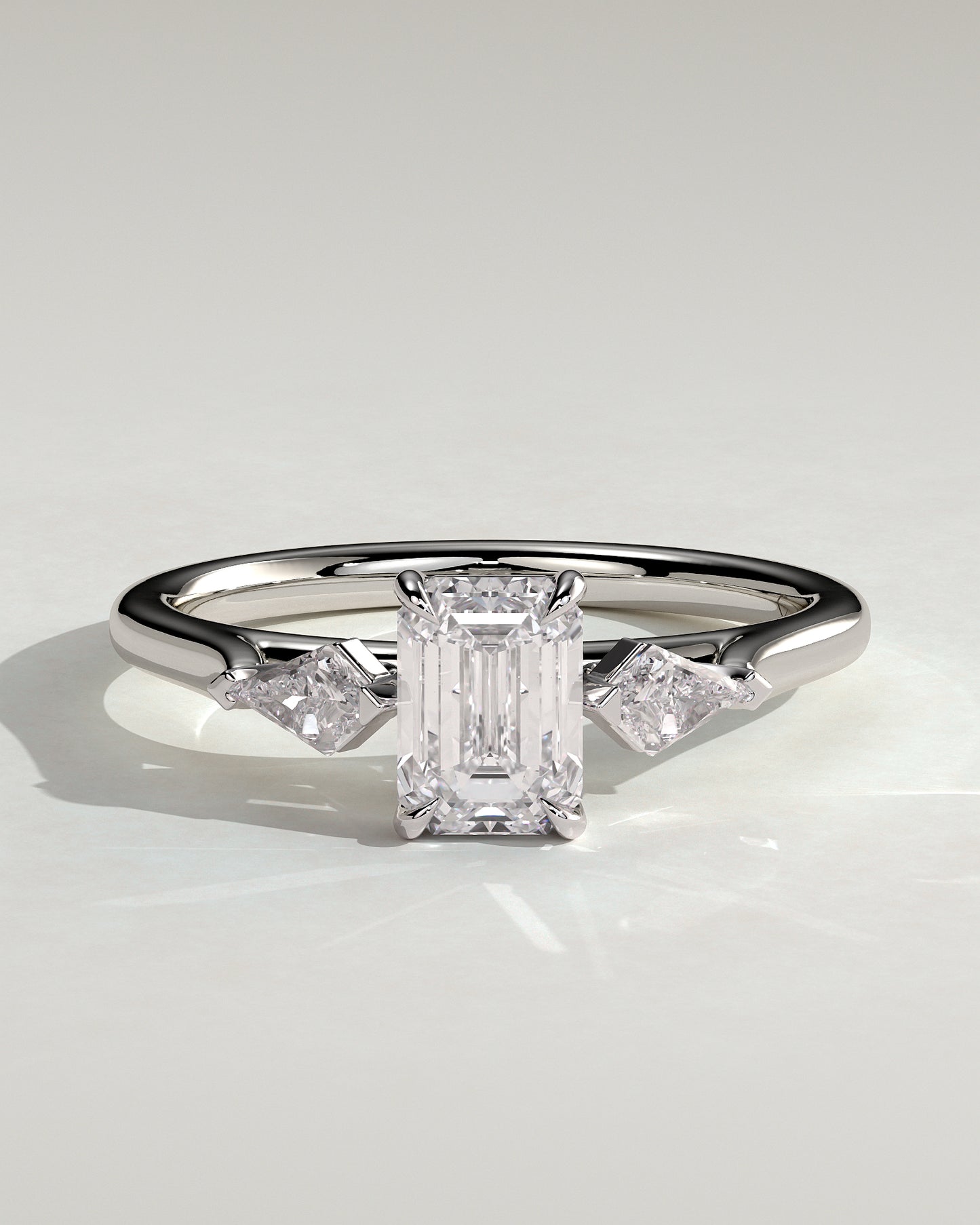 Elphie - Emerald Claw Trilogy with Kite Side Stones Engagement Ring - Platinum
