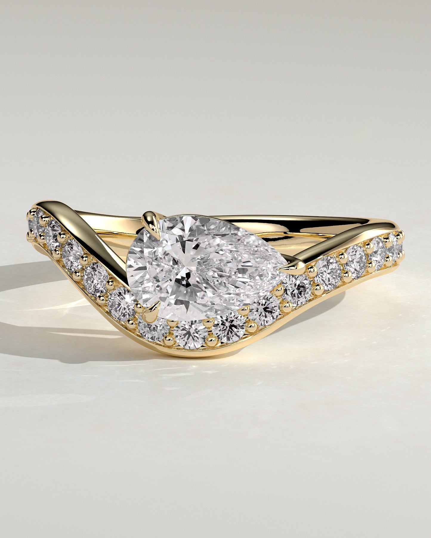 Eliza - Pear Claw Solitaire with Bead Set Pave Wave Band and East West Setting Engagement Ring - Yellow Gold