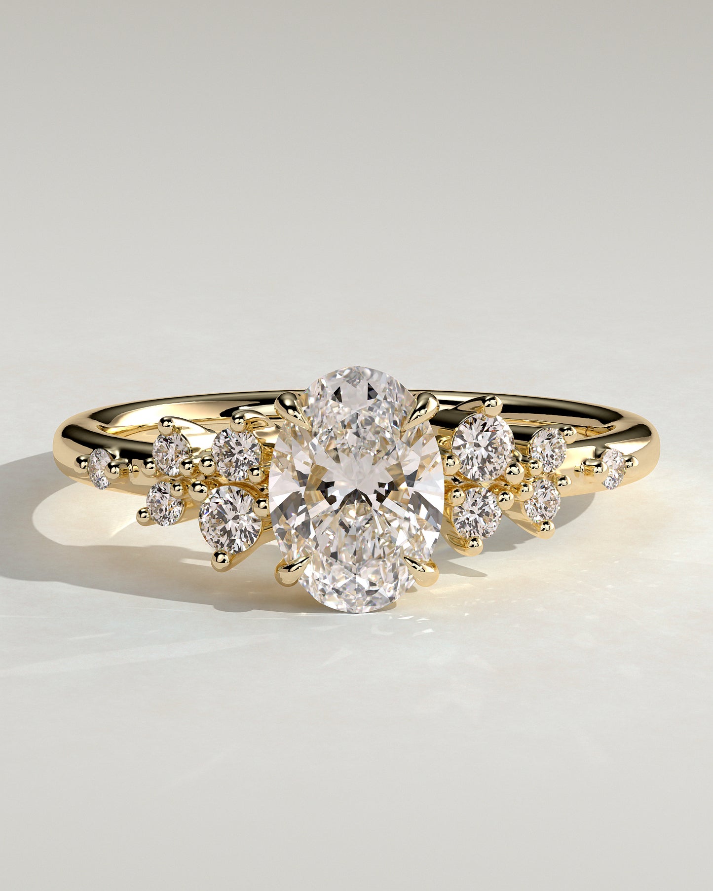 Bella - Oval Claw Solitaire with Clustered Round Shoulder Stones Engagement Ring - Yellow Gold