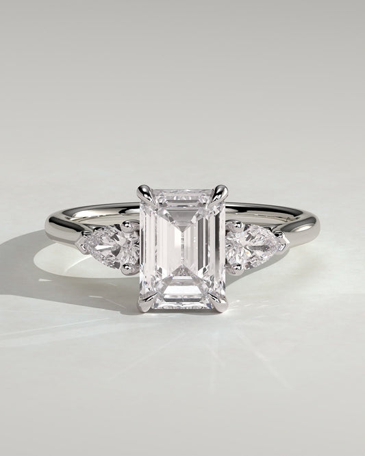 Davina - Emerald Claw Trilogy with Pear Side Stones and Cathedral Setting Engagement Ring - Platinum