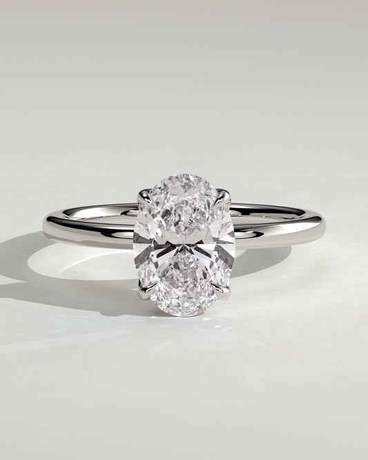 Aurelie - Oval Claw Solitaire with Petal Gallery and Accent Leaf Detail Engagement Ring - White Gold