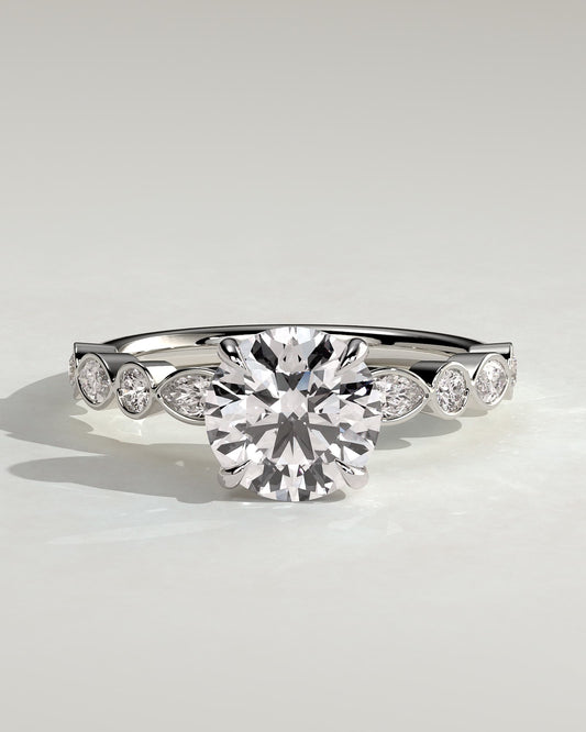 Cartia - Round Claw Solitaire with Round-Marquise Bezel Accent Stones Engagement Ring - White Gold