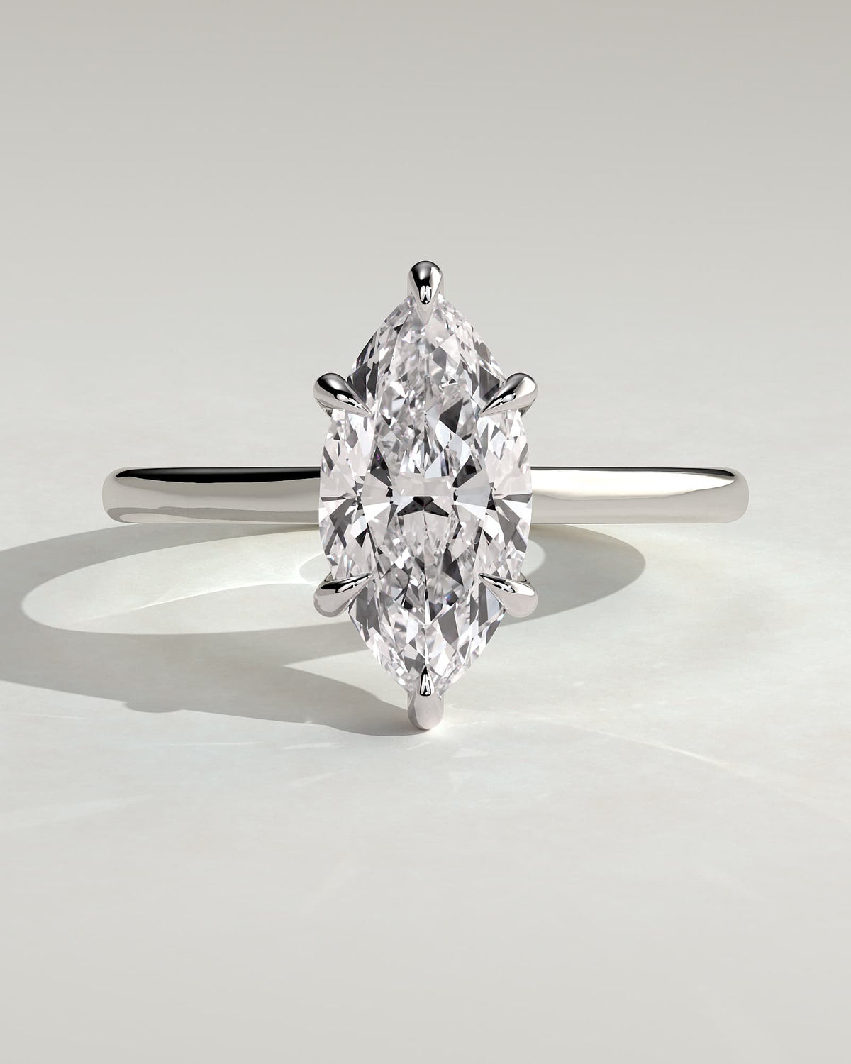Jenna - Marquise Claw Solitaire with Hidden Halo and Cathedral High Setting Engagement Ring - White Gold