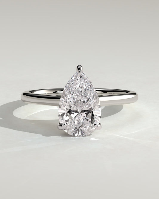 Kimberly - Pear Claw Solitaire with Hidden Halo and Cathedral High Setting Engagement Ring - White Gold