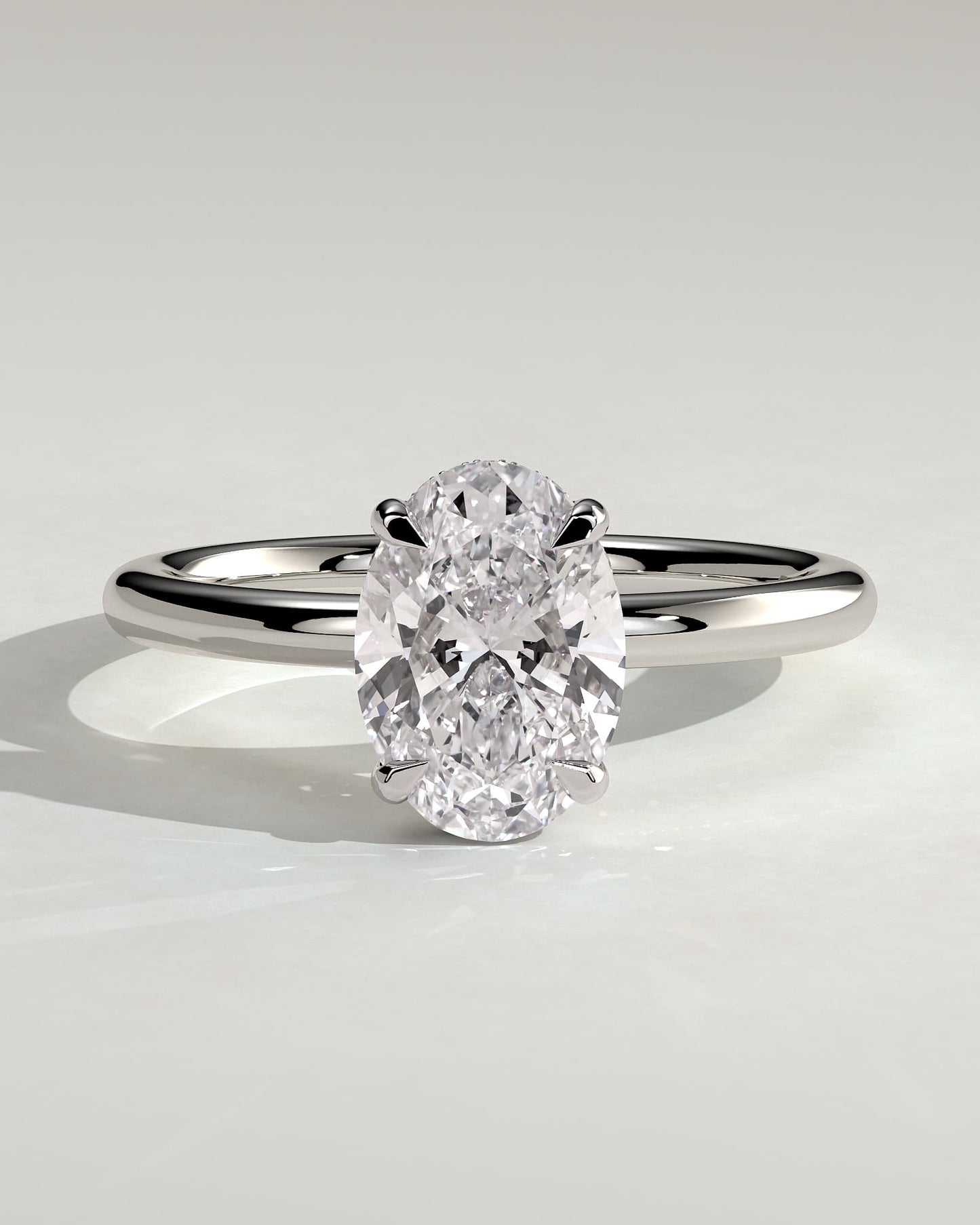Emma - Classic Oval Claw Solitaire with Hidden Halo Engagement Ring - Platinum