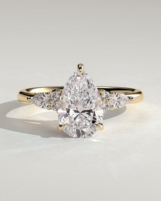 Lindsay - Pear Claw Solitaire with Pear Accents and Round Shoulder Stones Engagement Ring - Yellow Gold