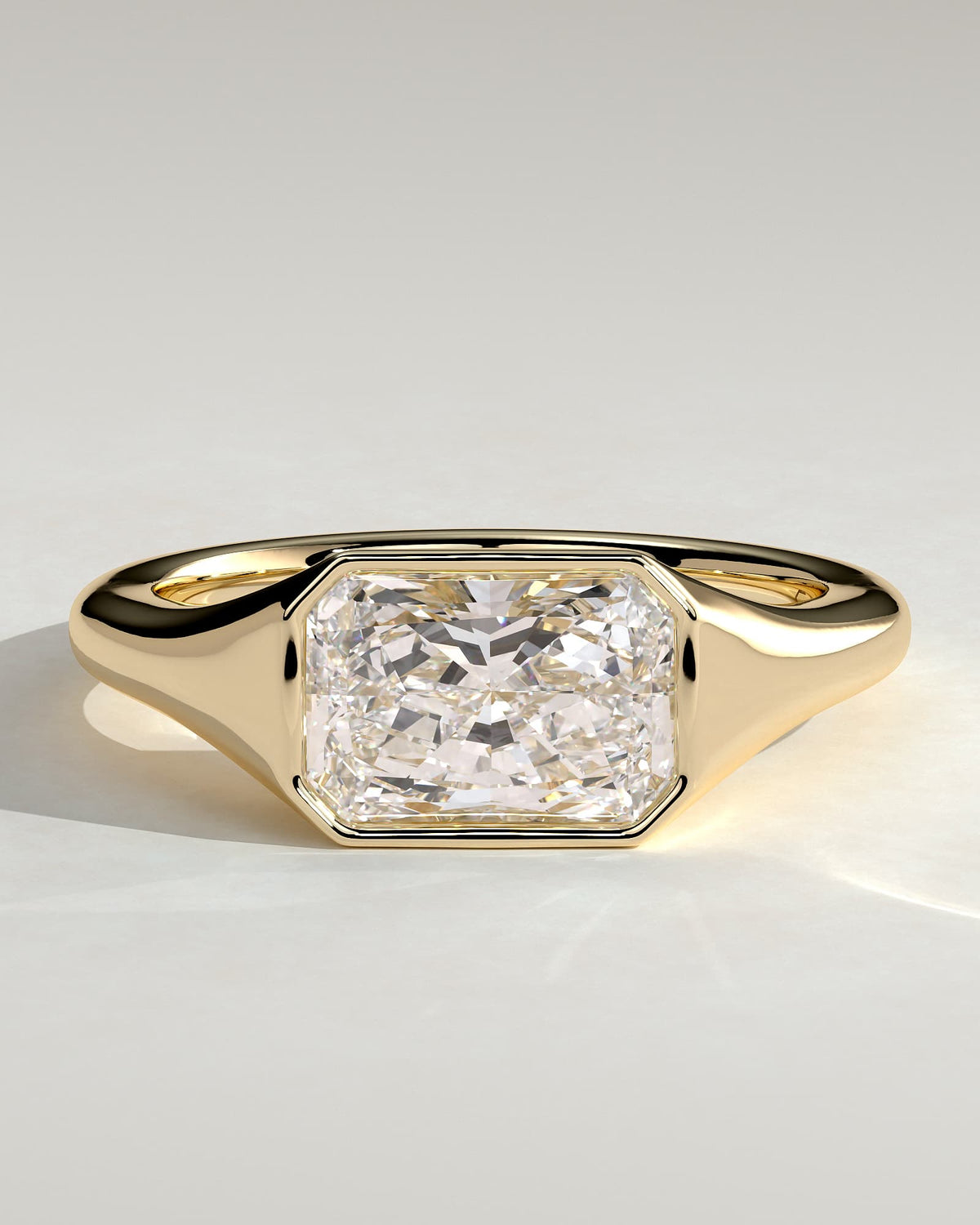 Mackenzie - Radiant East West Bezel Solitaire with Signet Band Engagement Ring - Yellow Gold
