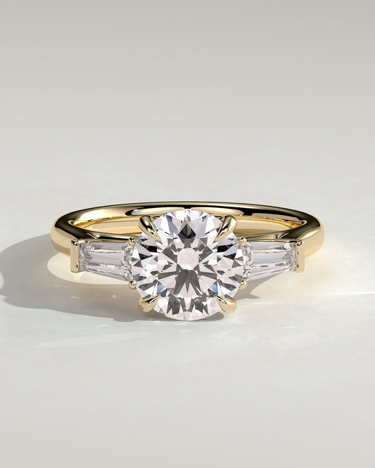 Marina - Round Claw Trilogy with Tapered Baguette Side Stones and Cathedral Setting Engagement Ring - Yellow Gold