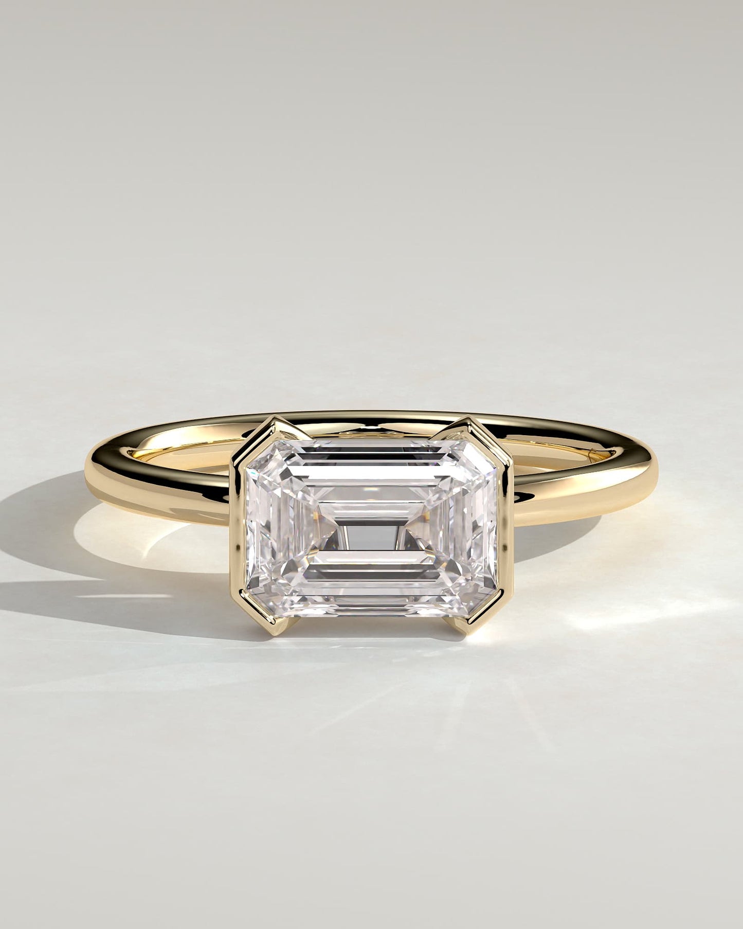 Jodie - Emerald East West Half Bezel Solitaire Engagement Ring - Yellow Gold