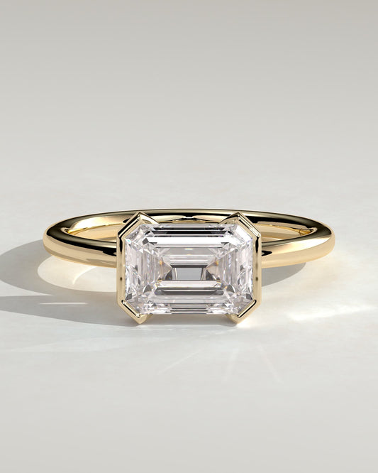 Jodie - Emerald East West Half Bezel Solitaire Engagement Ring - Yellow Gold