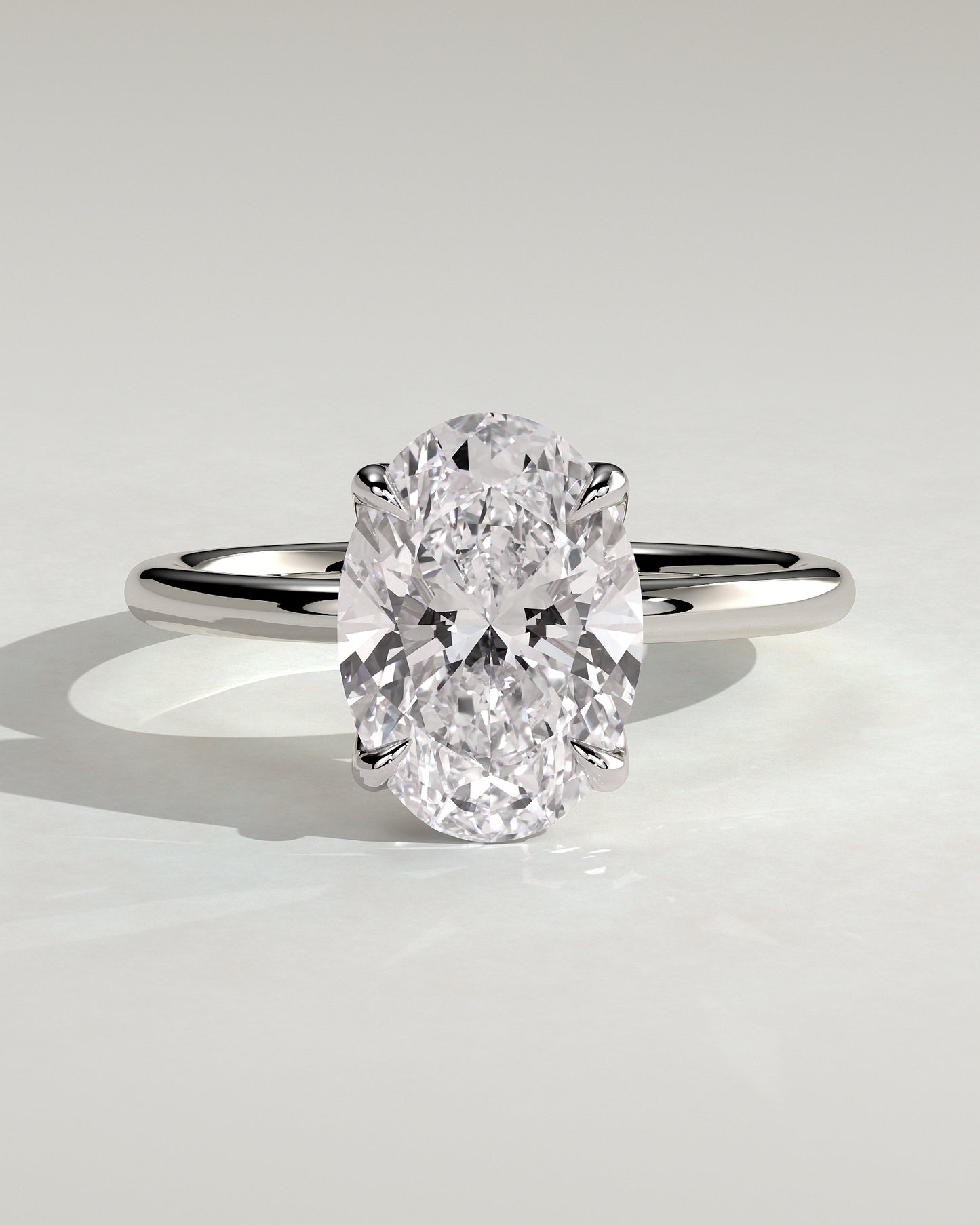 Aurelie - Oval Claw Solitaire with Petal Gallery and Accent Leaf Detail Engagement Ring - Platinum