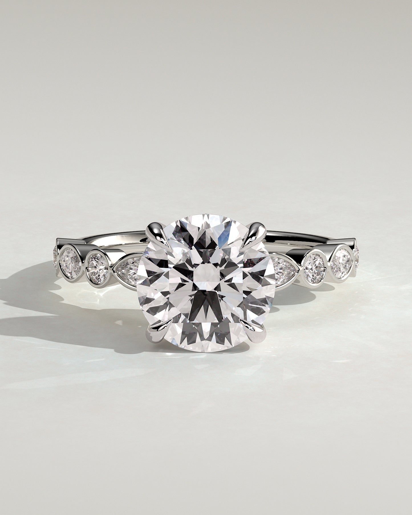 Cartia - Round Claw Solitaire with Round-Marquise Bezel Accent Stones Engagement Ring - Platinum