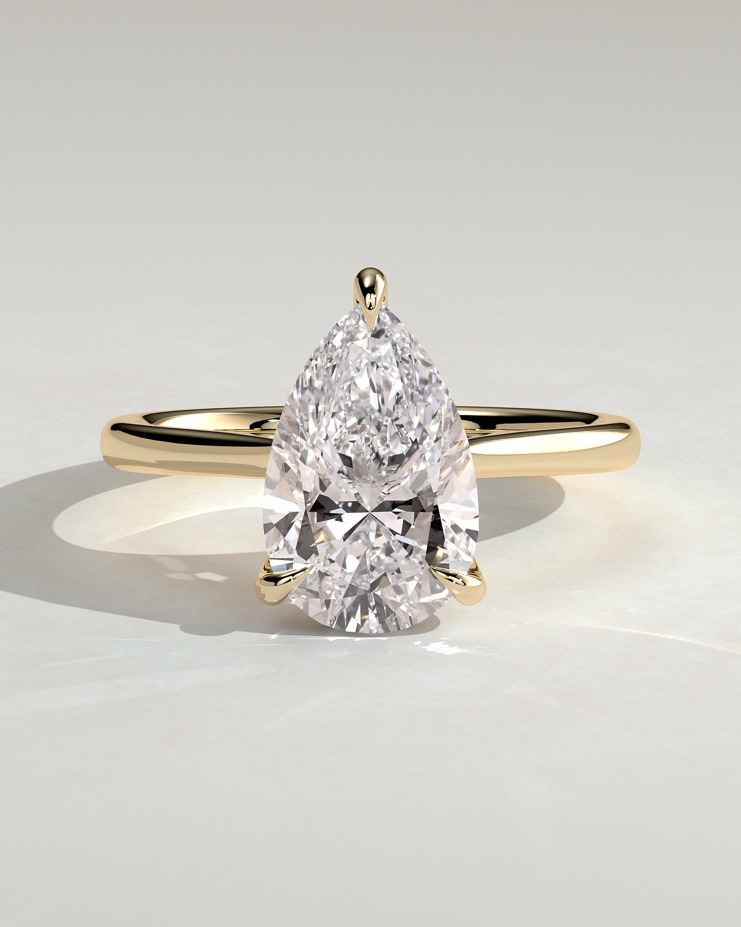 Courtney - Pear Claw Solitaire with Hidden Halo, Tapered Band and Cathedral High Setting Engagement Ring - Yellow Gold