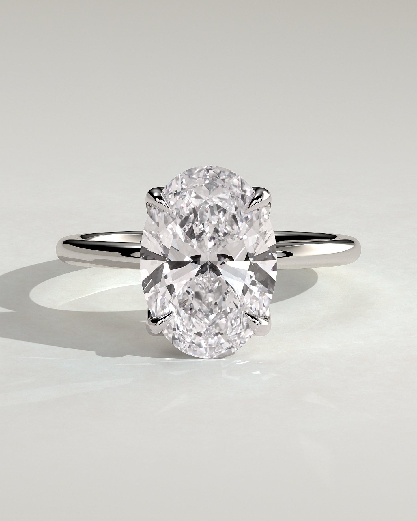 Aurelie - Oval Claw Solitaire with Petal Gallery and Accent Leaf Detail Engagement Ring - Platinum