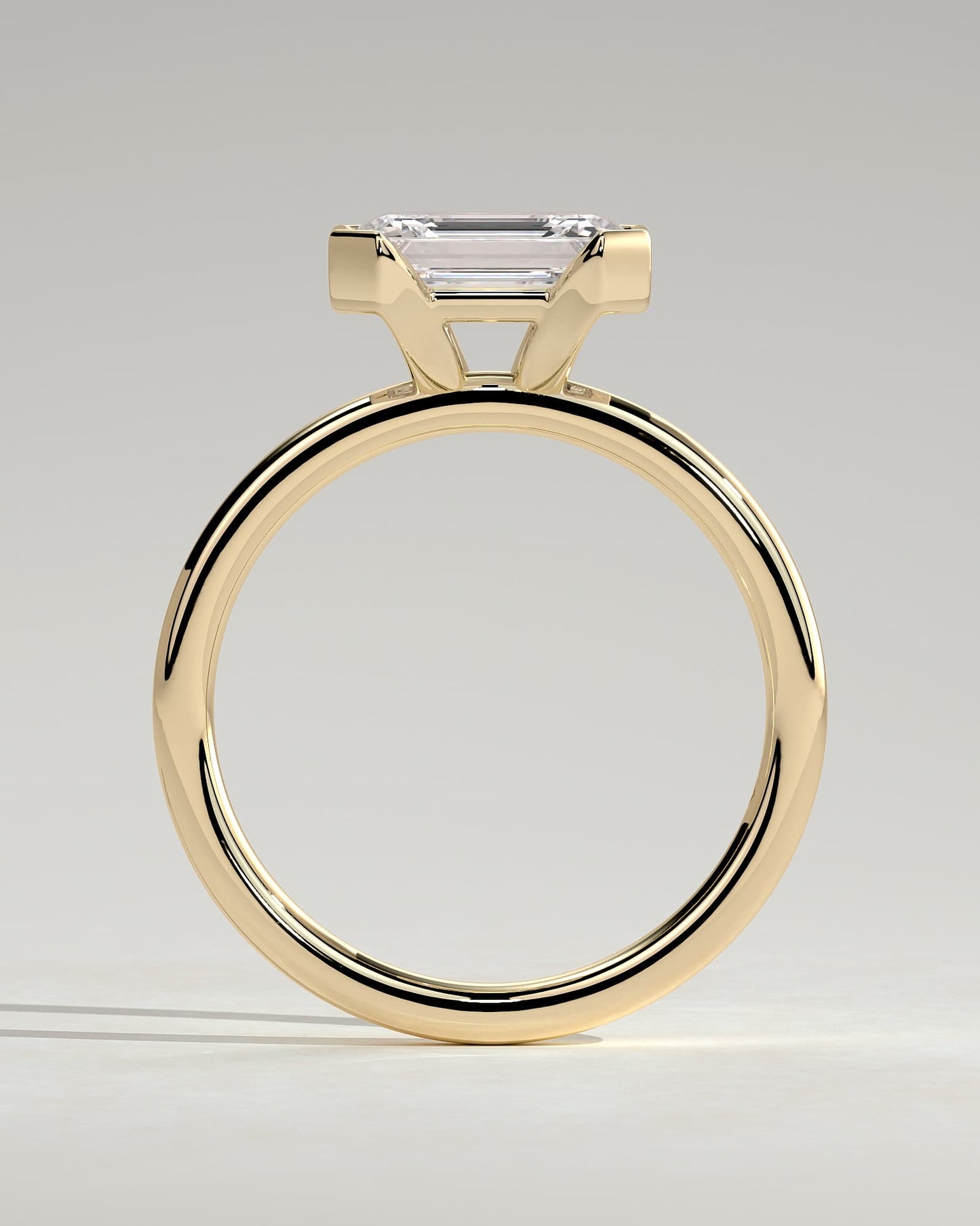 Jodie - Emerald East West Half Bezel Solitaire Engagement Ring - Yellow Gold