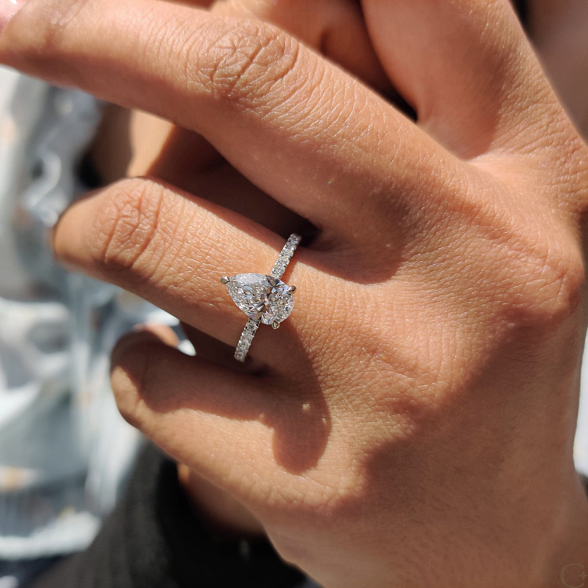 Pear Cut Engagement Ring With Hidden Halo Design