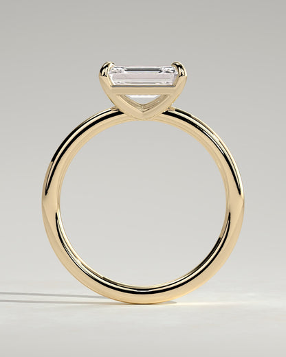 Debbie - Emerald East West Claw Solitaire Engagement Ring - Yellow Gold
