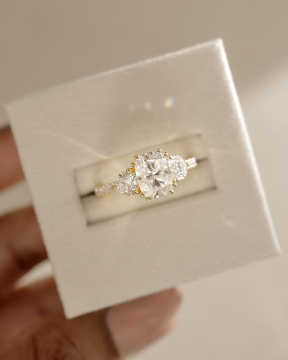 Meghan - Elongated Cushion Double Claw Trilogy with Round Side Stones, Pave Band and Cathedral Setting Engagement Ring - Platinum