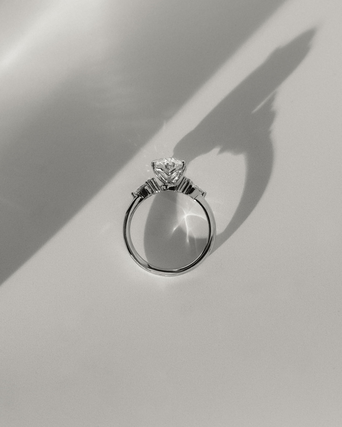 Sheridan - Oval Claw Solitaire with Pear Accents and Round Shoulder Stones Engagement Ring - Platinum