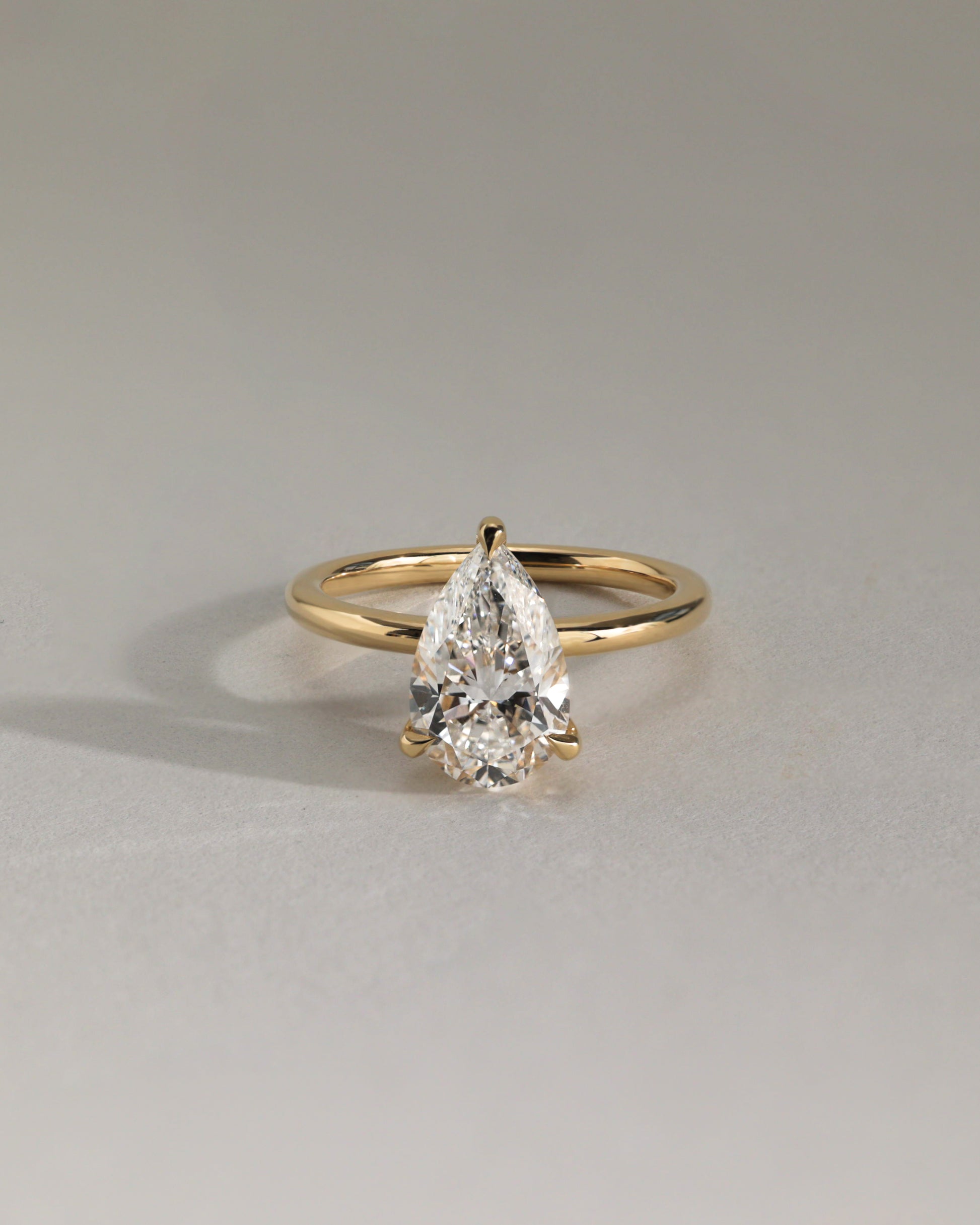 Amy - Pear Claw Solitaire Engagement Ring - Rose Two-Tone - Lifestyle