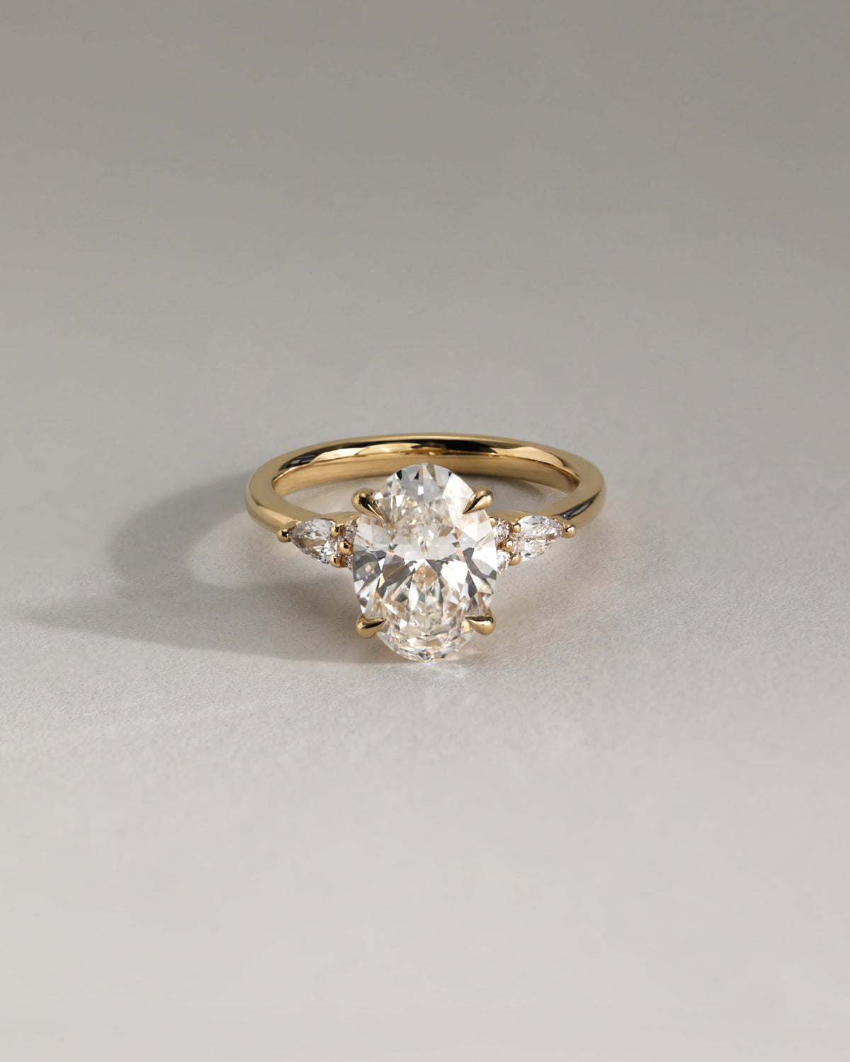 Sheridan - Oval Claw Solitaire with Pear Accents and Round Shoulder Stones Engagement Ring - Platinum