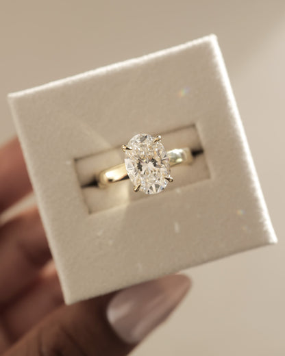 Bronte - Oval Claw Solitaire with Cigar Band and Hidden Halo Engagement Ring - Yellow Gold