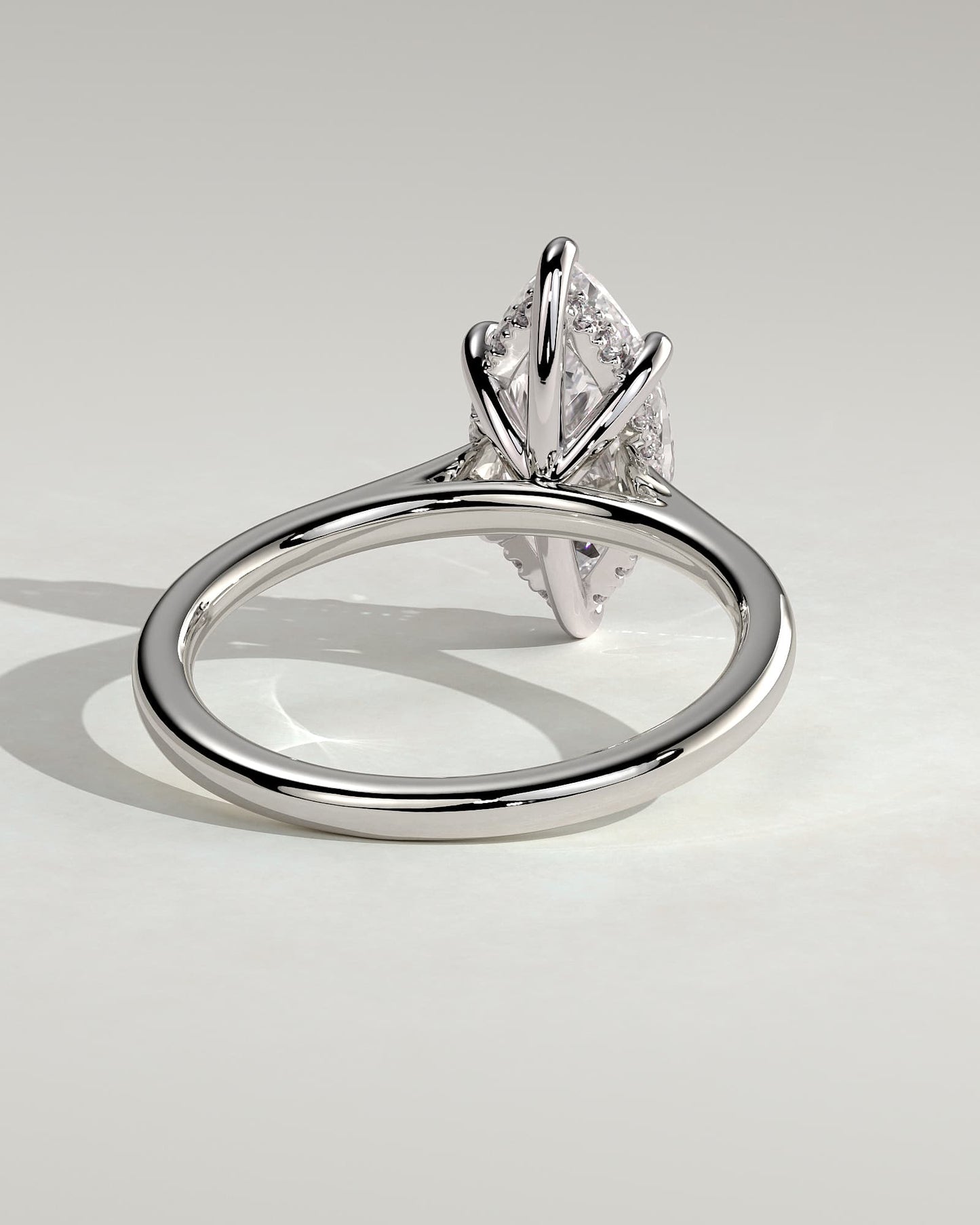 Jenna - Marquise Claw Solitaire with Hidden Halo and Cathedral High Setting Engagement Ring - Platinum
