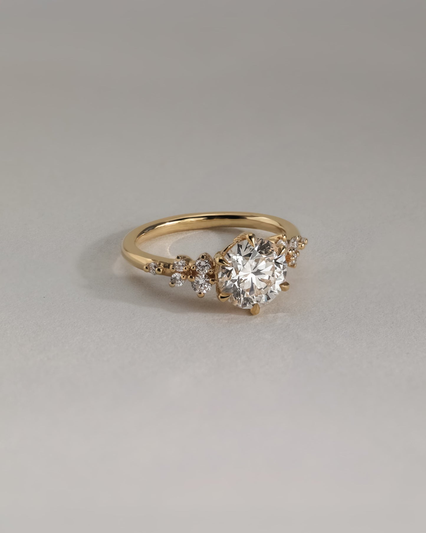 Molly - Round Claw Solitaire with Clustered Round Shoulder Stones Engagement Ring - Yellow Gold