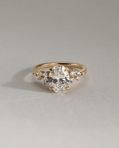Bella - Oval Claw Solitaire with Clustered Round Shoulder Stones Engagement Ring - Yellow Gold