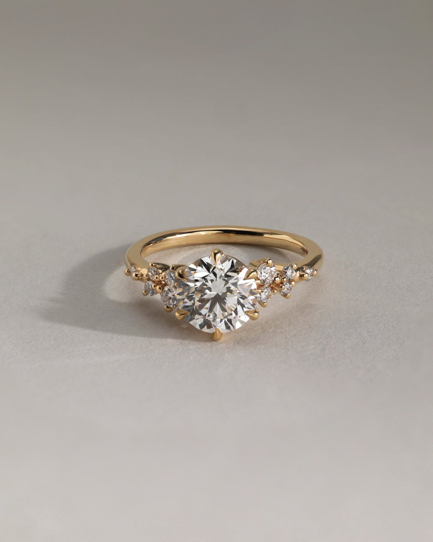 Molly - Round Claw Solitaire with Clustered Round Shoulder Stones Engagement Ring - Yellow Gold