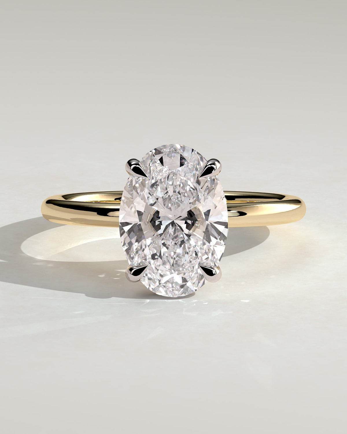 Emma - Classic Oval Claw Solitaire with Hidden Halo Engagement Ring - Yellow Two-Tone