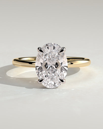 Emma - Classic Oval Claw Solitaire with Hidden Halo Engagement Ring - Yellow Two-Tone