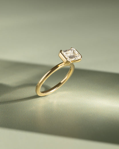 Jodie - Emerald East West Half Bezel Solitaire Engagement Ring - Yellow Gold