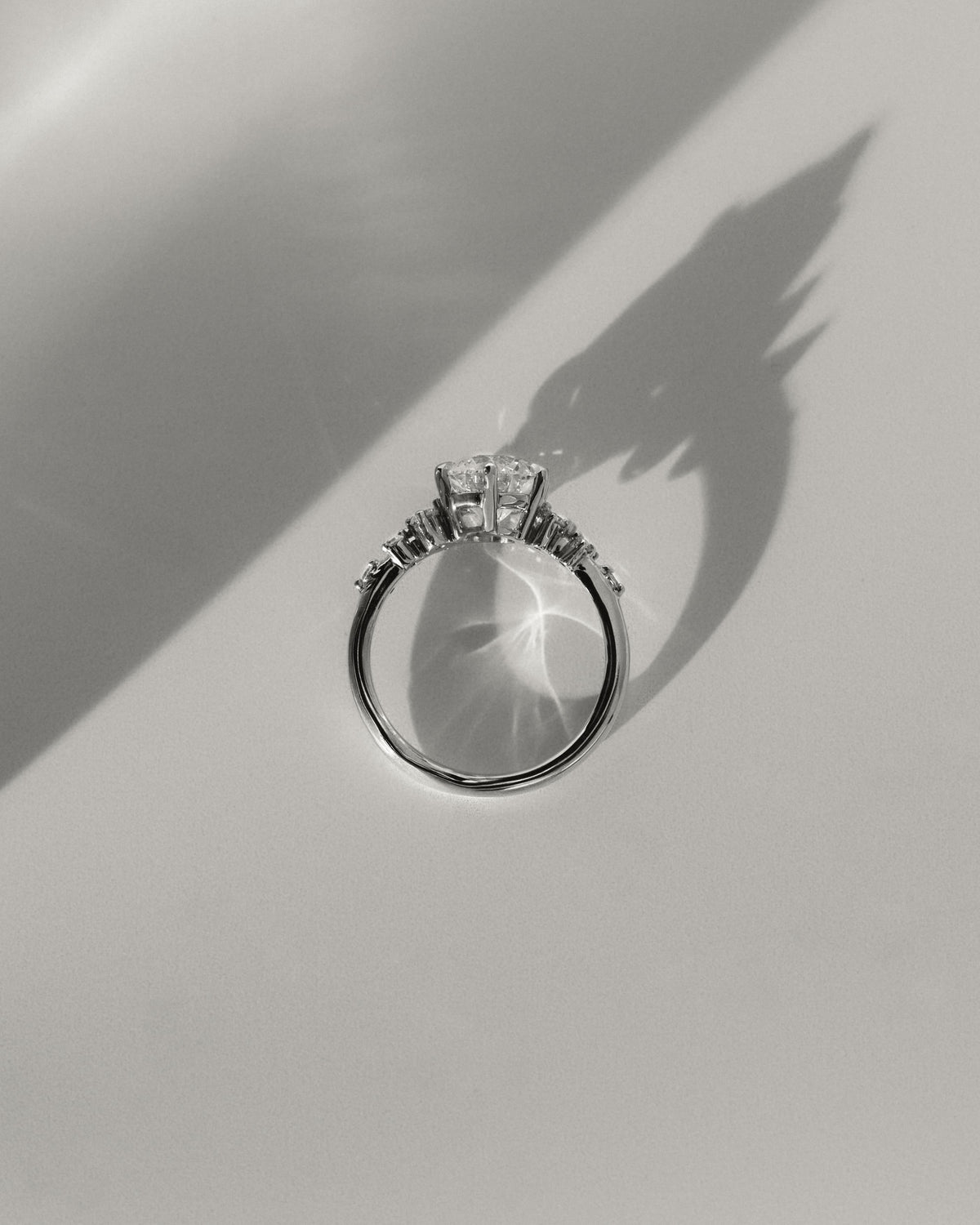 Molly - Round Claw Solitaire with Clustered Round Shoulder Stones Engagement Ring - Platinum