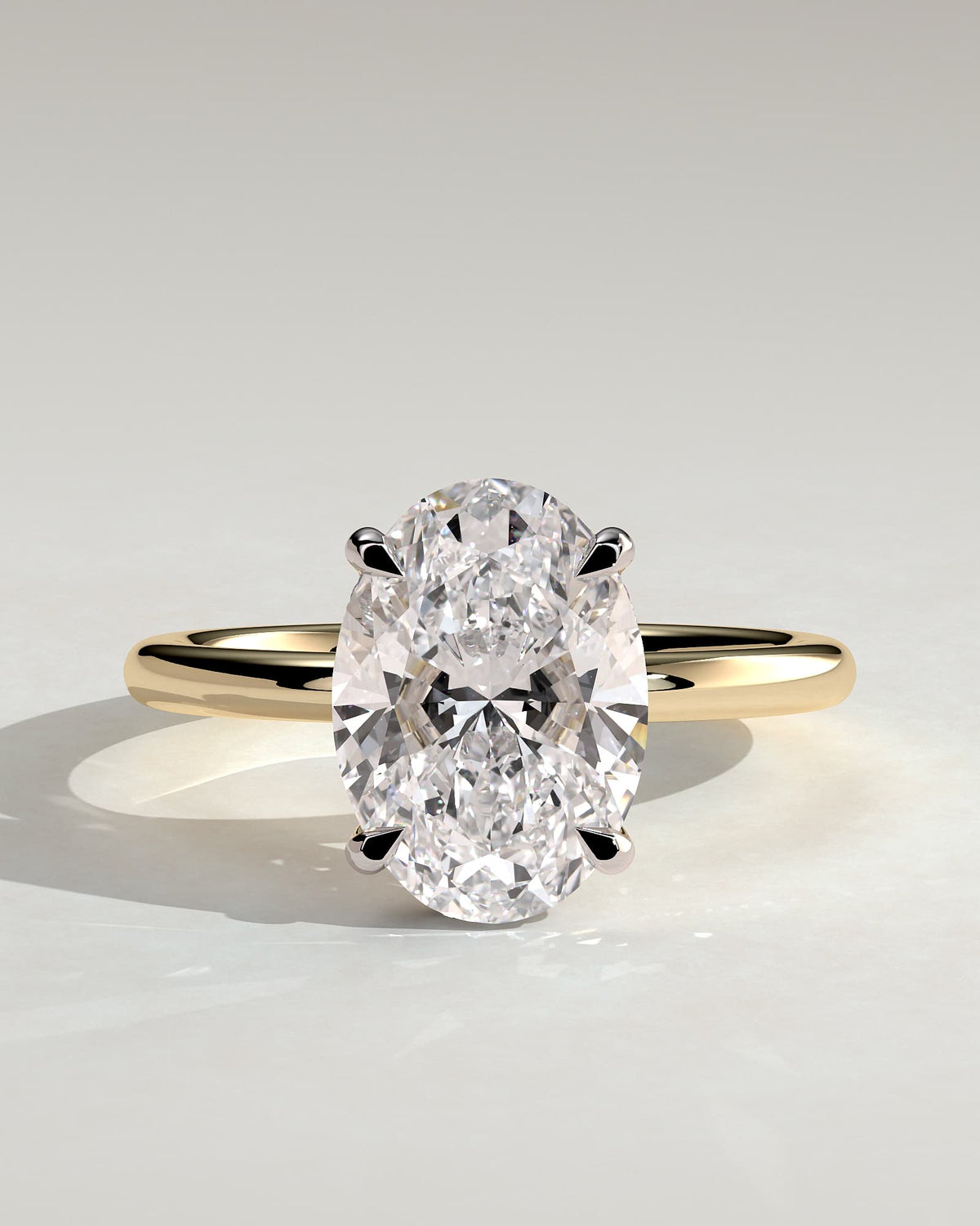 Emma - Classic Oval Claw Solitaire with Hidden Halo Engagement Ring - Yellow Two-Tone