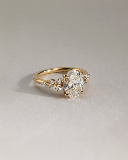 Bella - Oval Claw Solitaire with Clustered Round Shoulder Stones Engagement Ring - Platinum