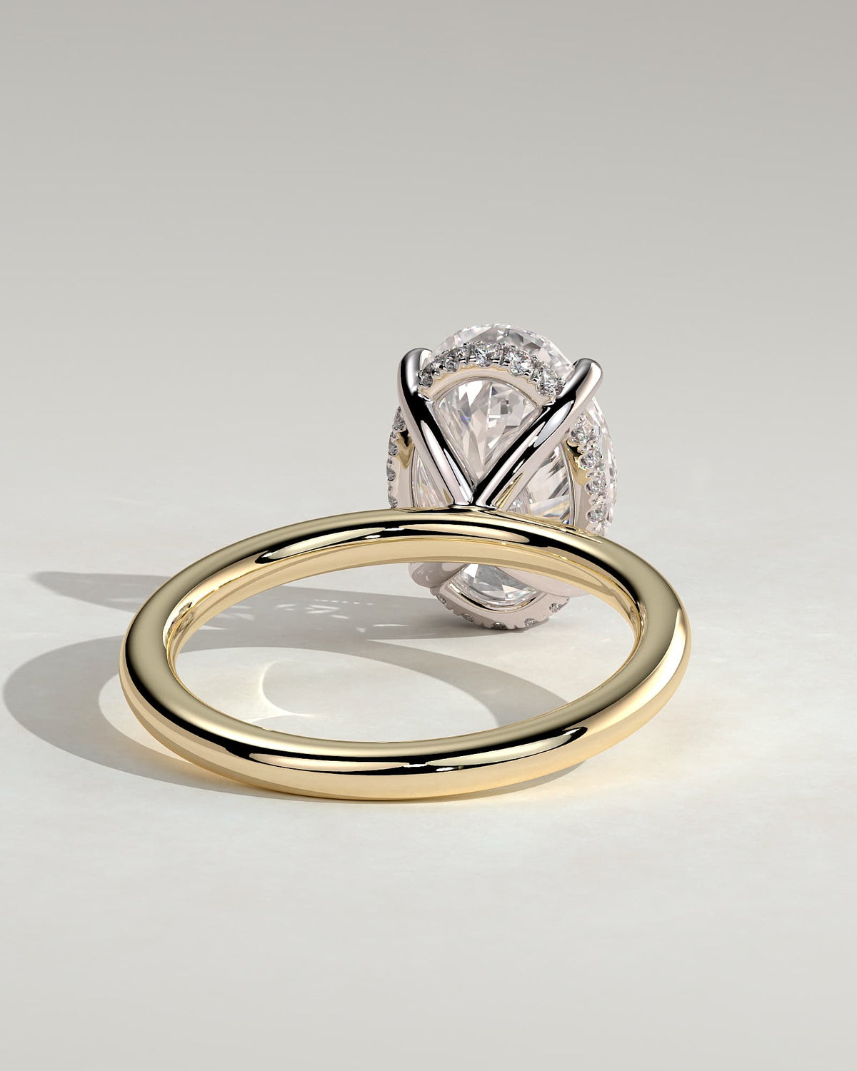Emma - Classic Oval Claw Solitaire with Hidden Halo Engagement Ring - Yellow Two-Tone
