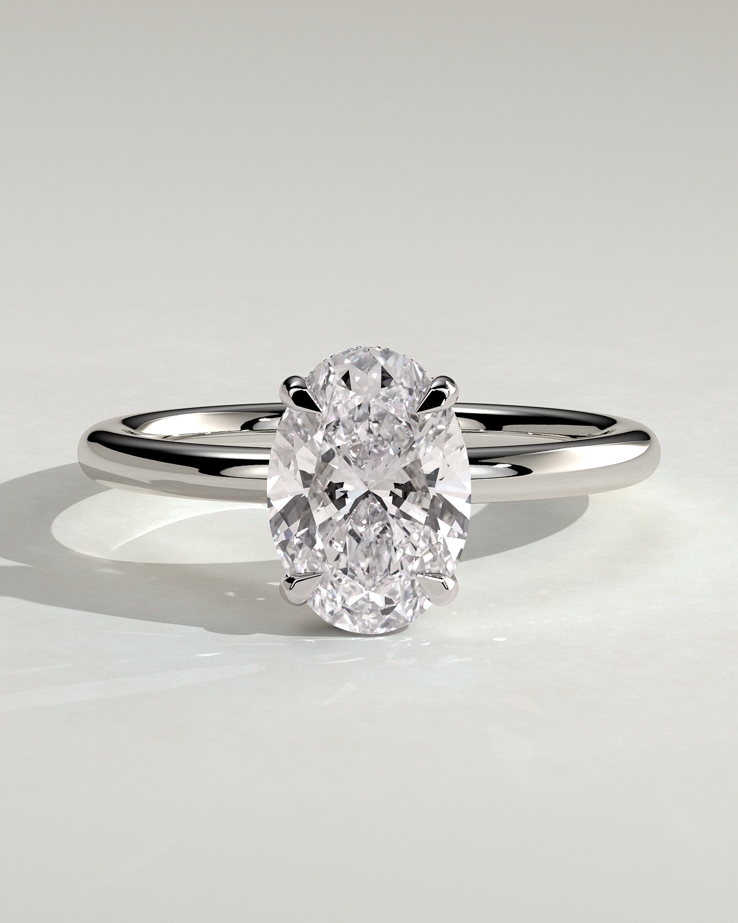 Emma - Classic Oval 4 Claw Solitaire with Hidden Halo Engagement Ring - 18k White Gold High Setting