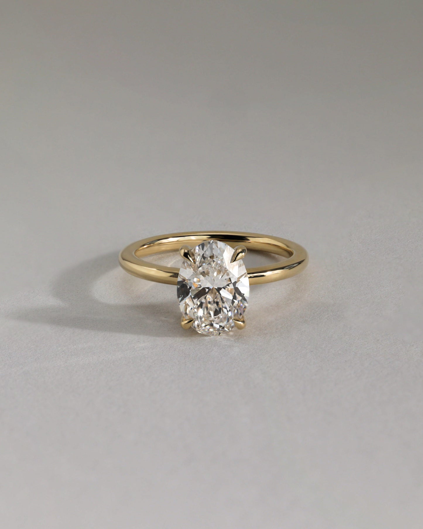 Emma - Classic Oval Claw Solitaire with Hidden Halo Engagement Ring - Rose Gold - Lifestyle