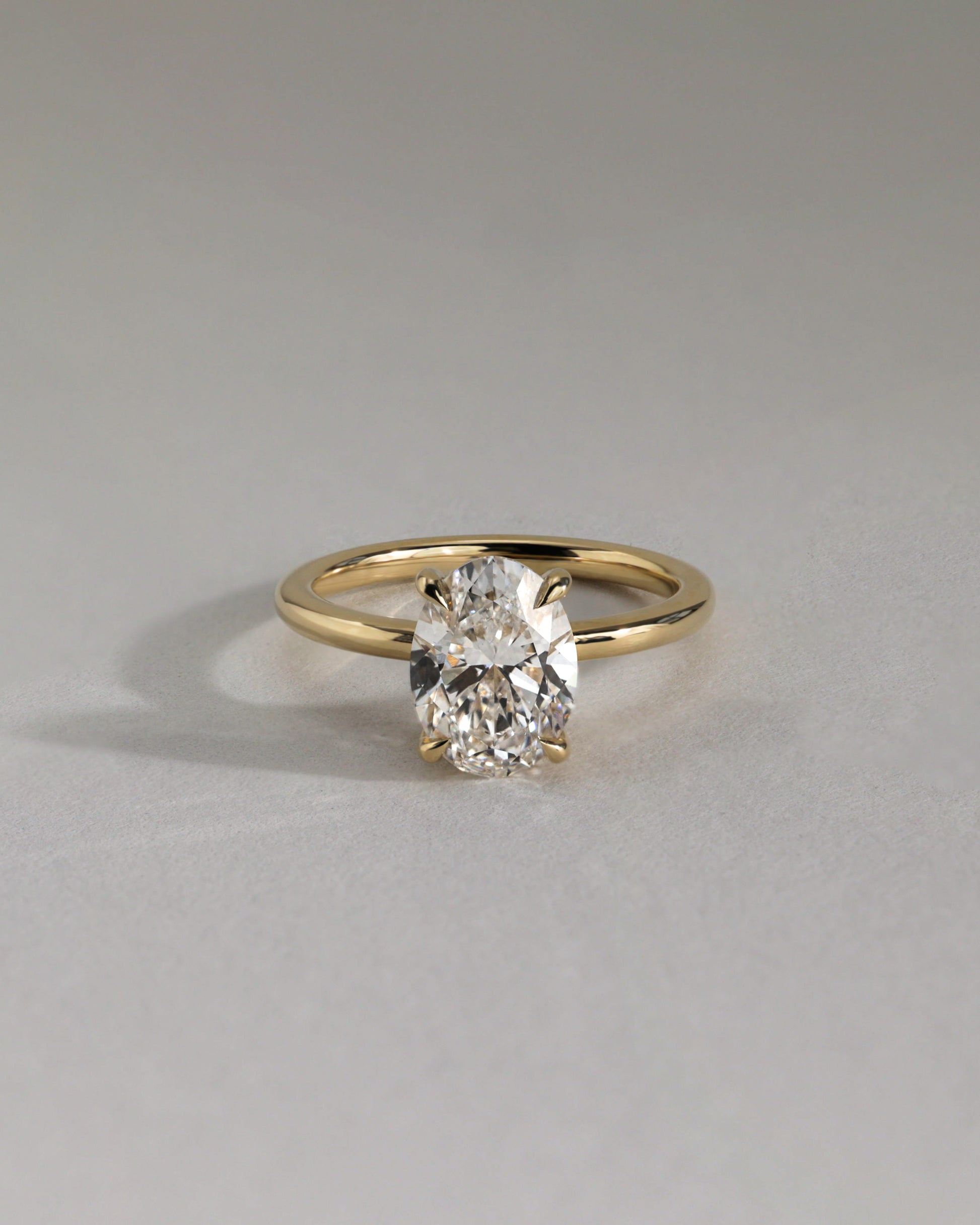 Emma - Classic Oval Claw Solitaire with Hidden Halo Engagement Ring - Rose Gold - Lifestyle