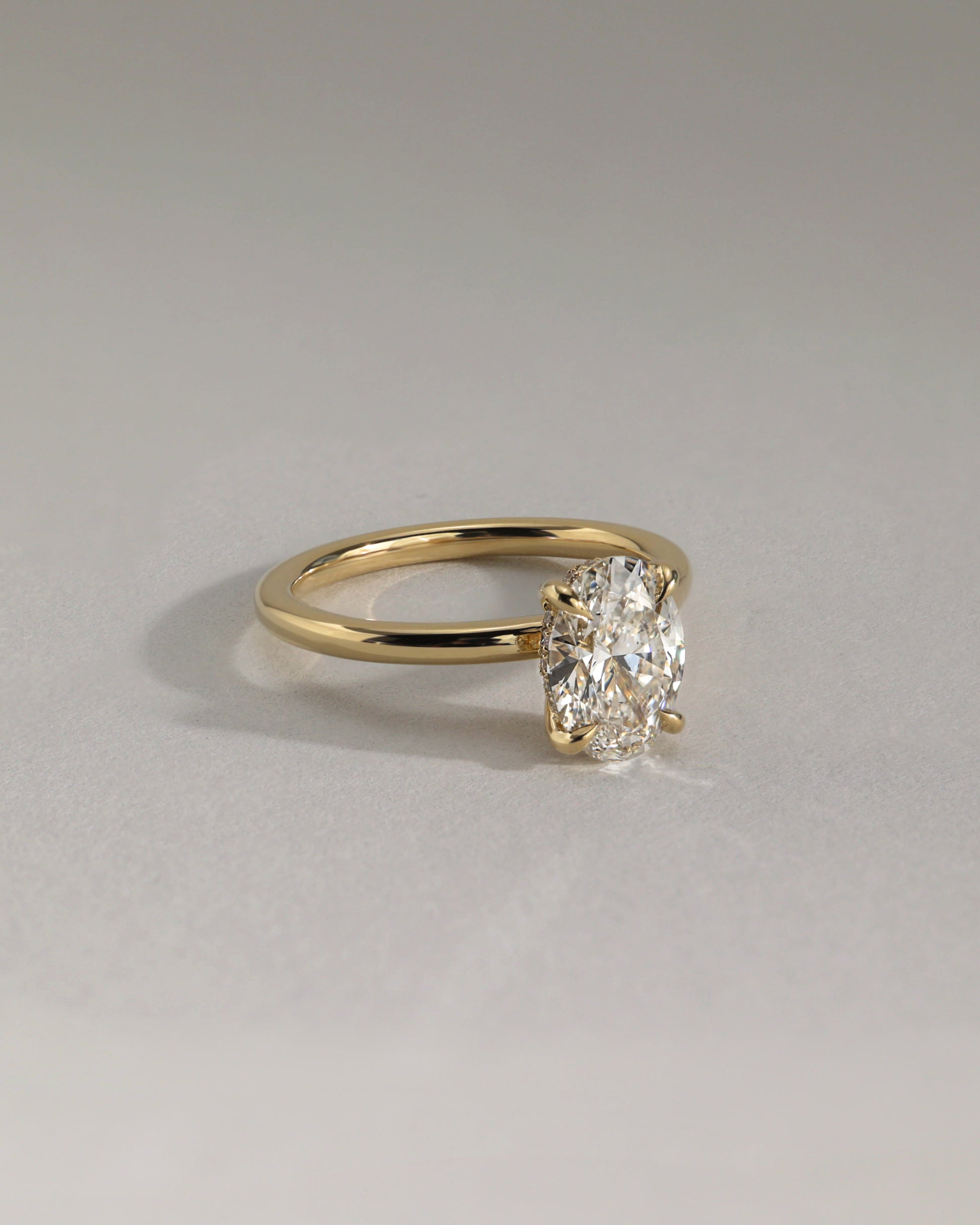 Emma - Classic Oval Claw Solitaire with Hidden Halo Engagement Ring - White Gold / Platinum - Lifestyle