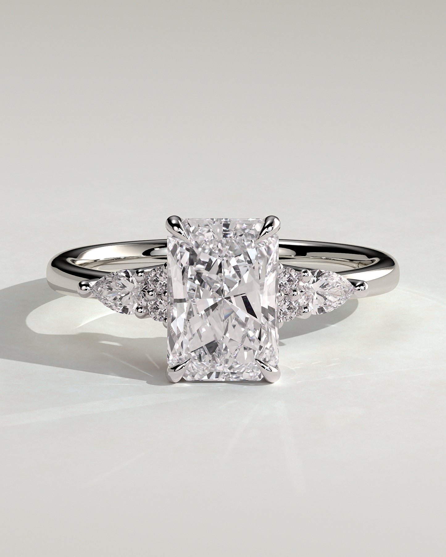 Heidi - Radiant Claw Solitaire with Pear Accents and Round Shoulder Stones Engagement Ring - Platinum - White Gold / Platinum 2ct