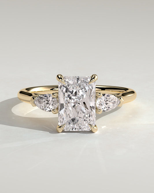 Jasmine - Radiant Claw Trilogy with Pear Side Stones and Cathedral Setting Engagement Ring - Yellow Gold