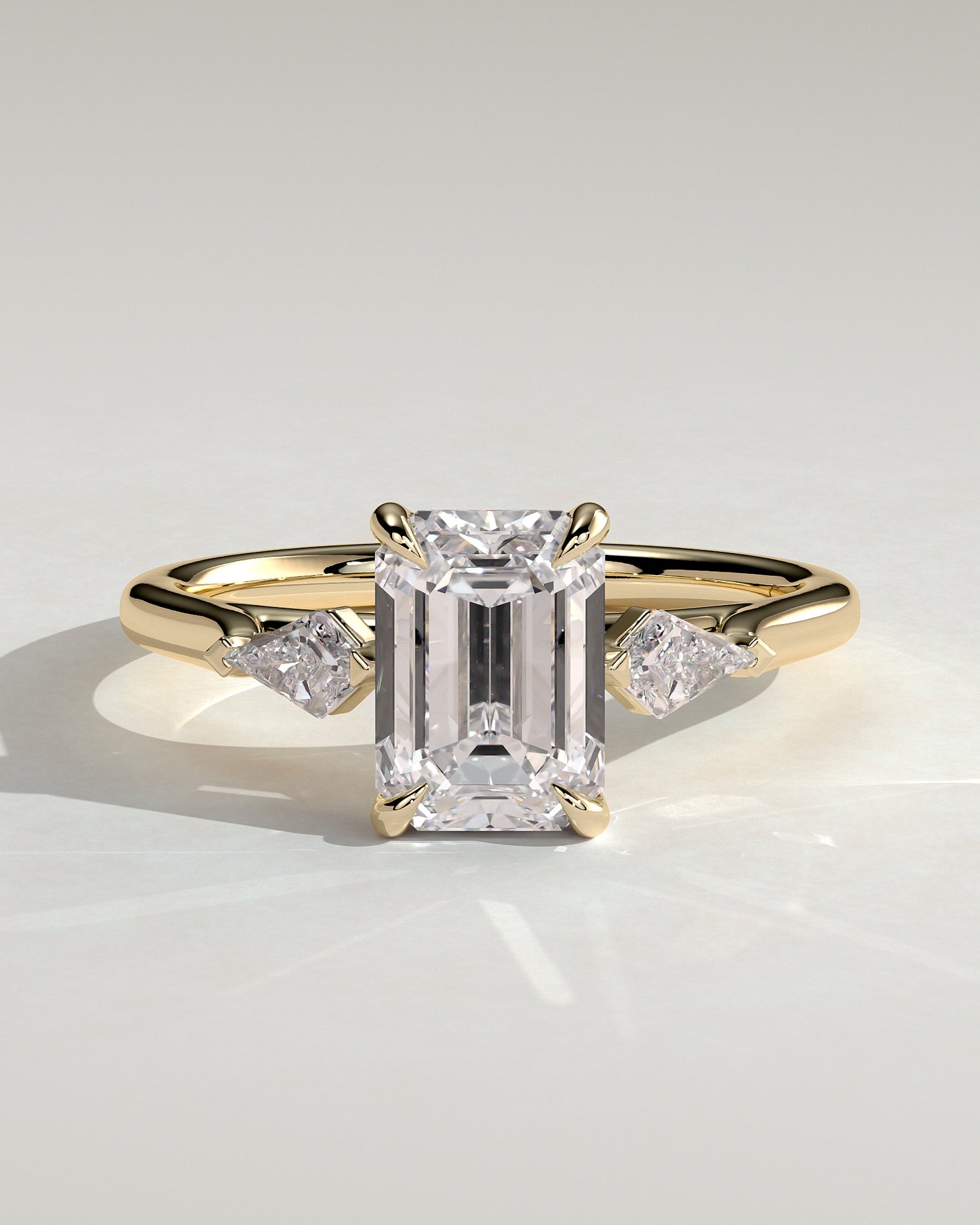 Elphie - Emerald Claw Trilogy with Kite Side Stones Engagement Ring - Platinum