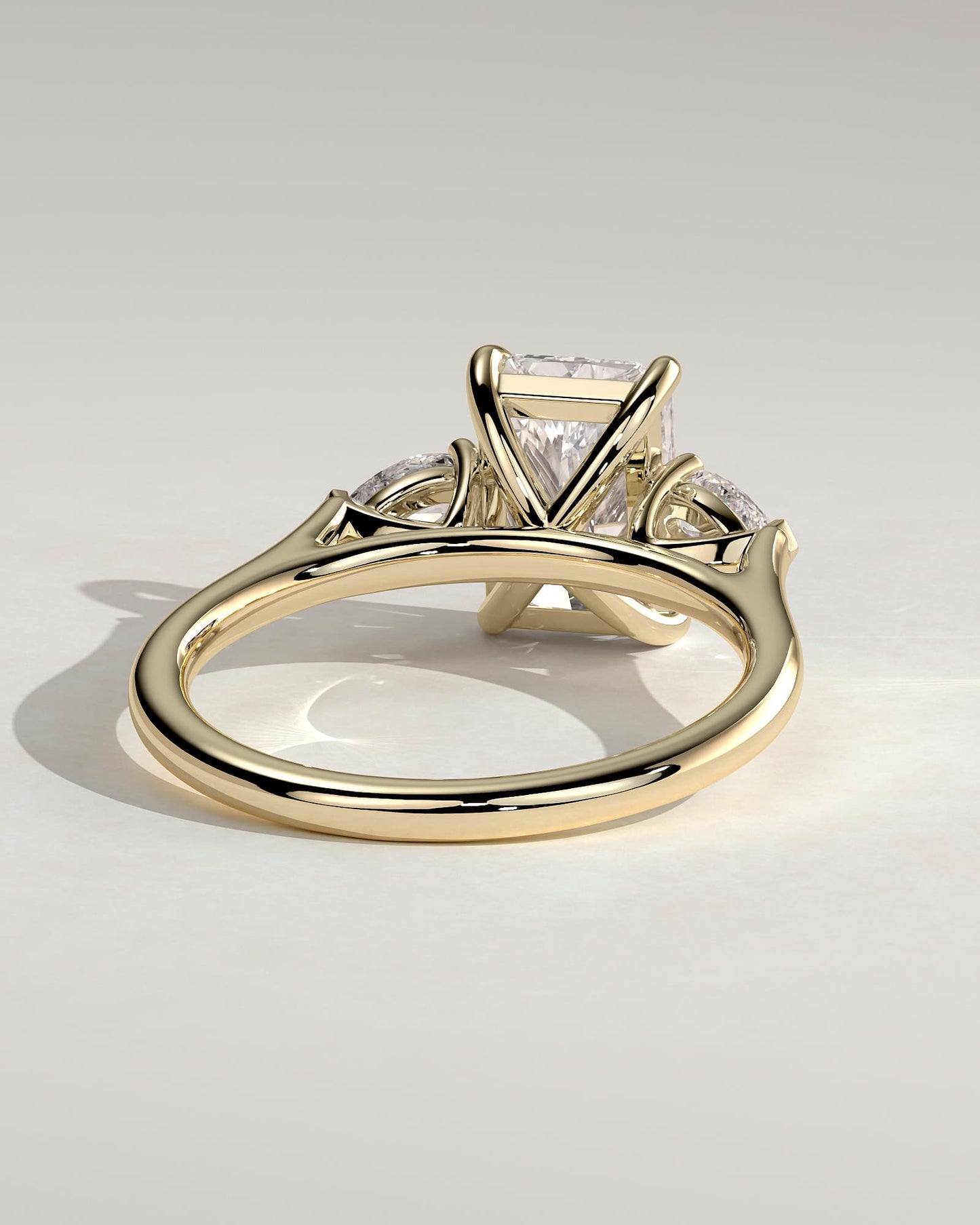 Jasmine - Radiant Claw Trilogy with Pear Side Stones and Cathedral Setting Engagement Ring - Yellow Gold