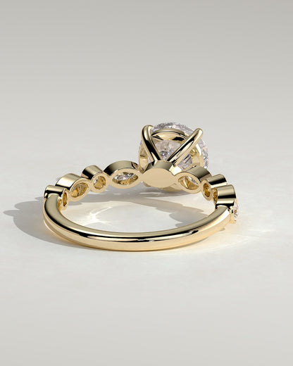 Cartia - Round Claw Solitaire with Round-Marquise Bezel Accent Stones Engagement Ring - Yellow Gold